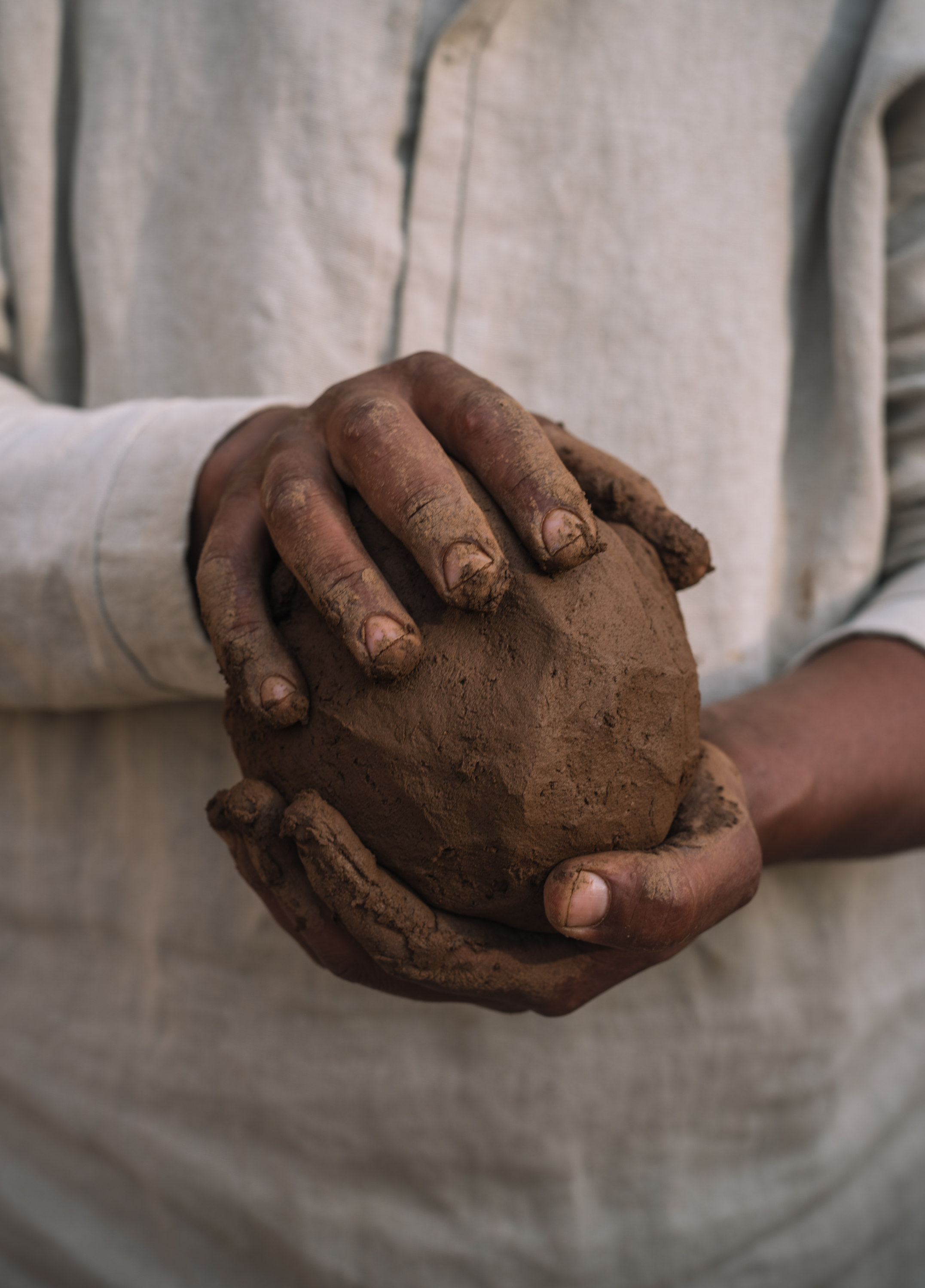 Man with clay in shirt SONORA 22005 photographed for the Azimuth 2026 fabric collection by Designs of the Time