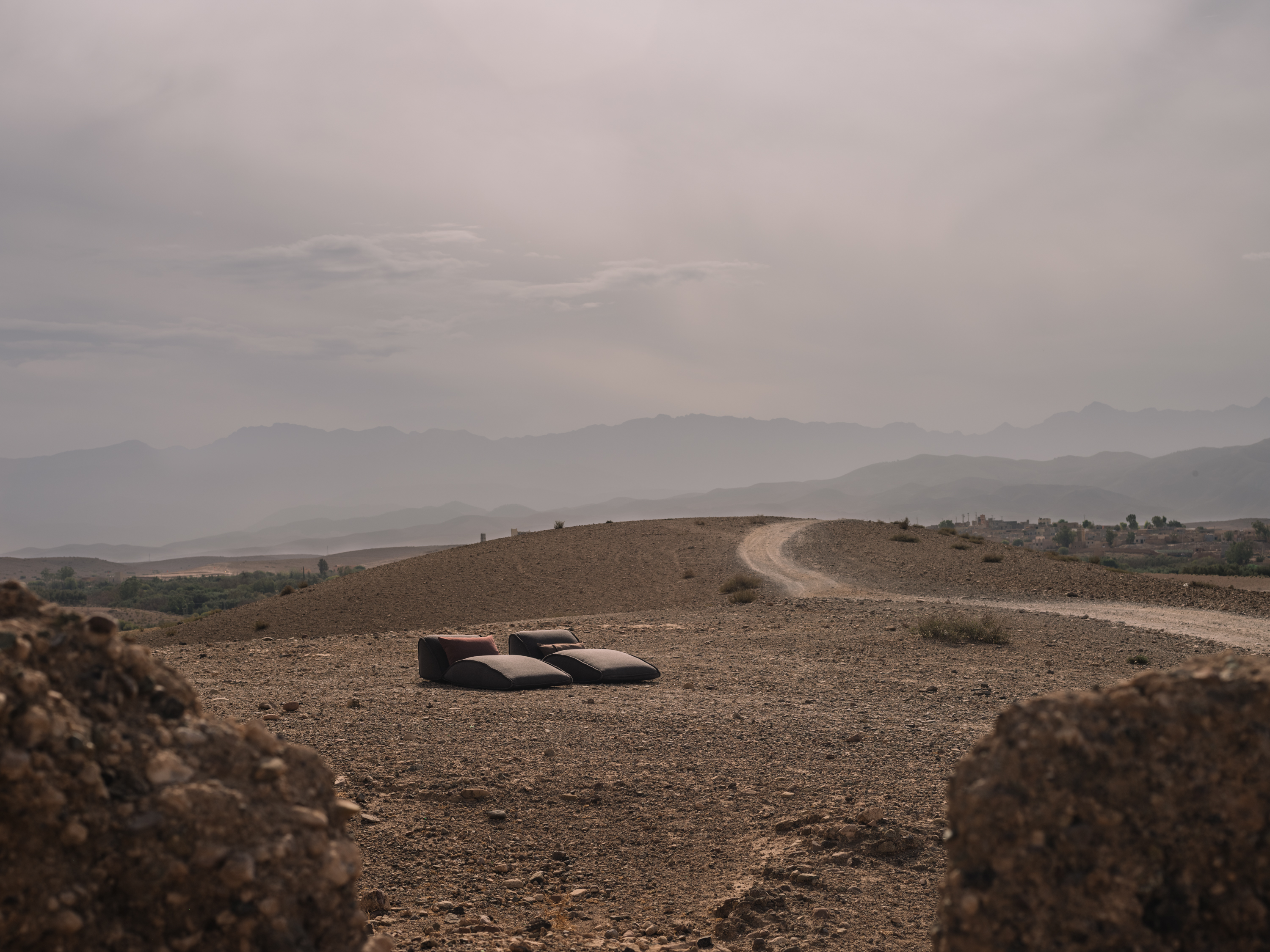 Outdoor daybeds TAR YP26009 Outdoor cushions SAKONDU YP25012, YP25014 photographed in the Moroccan desert for the Azimuth 2026 fabric collection by Designs of the Time