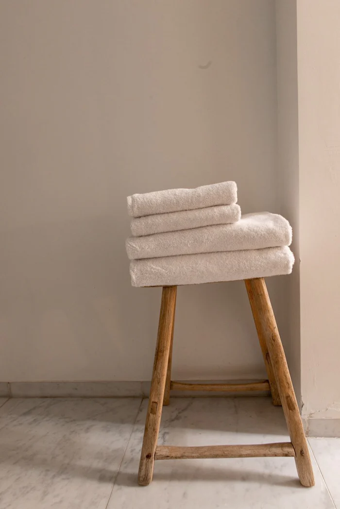 Some towels on top of a small chair