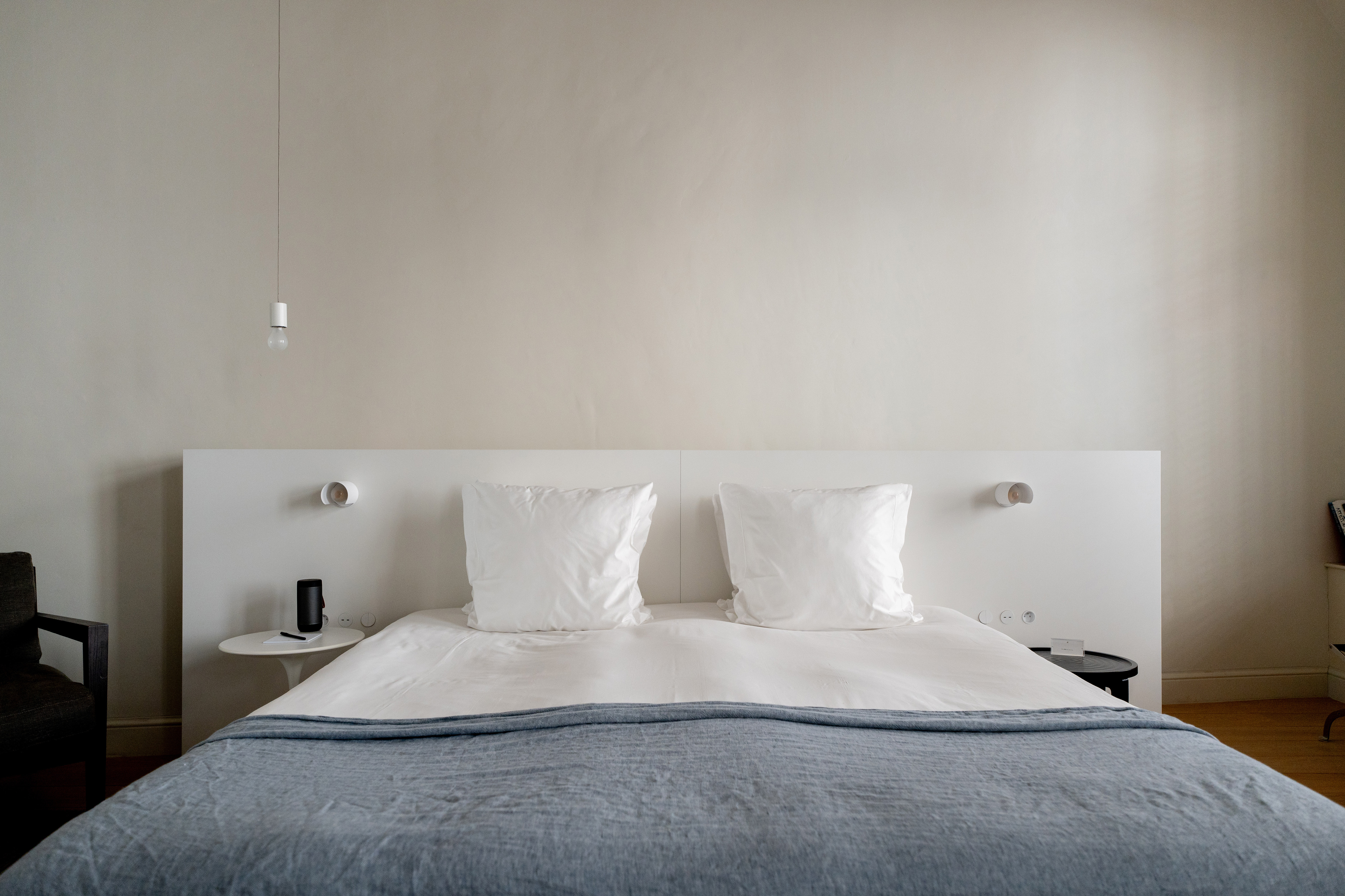 Spacious and minimal bedroom featuring a double bed