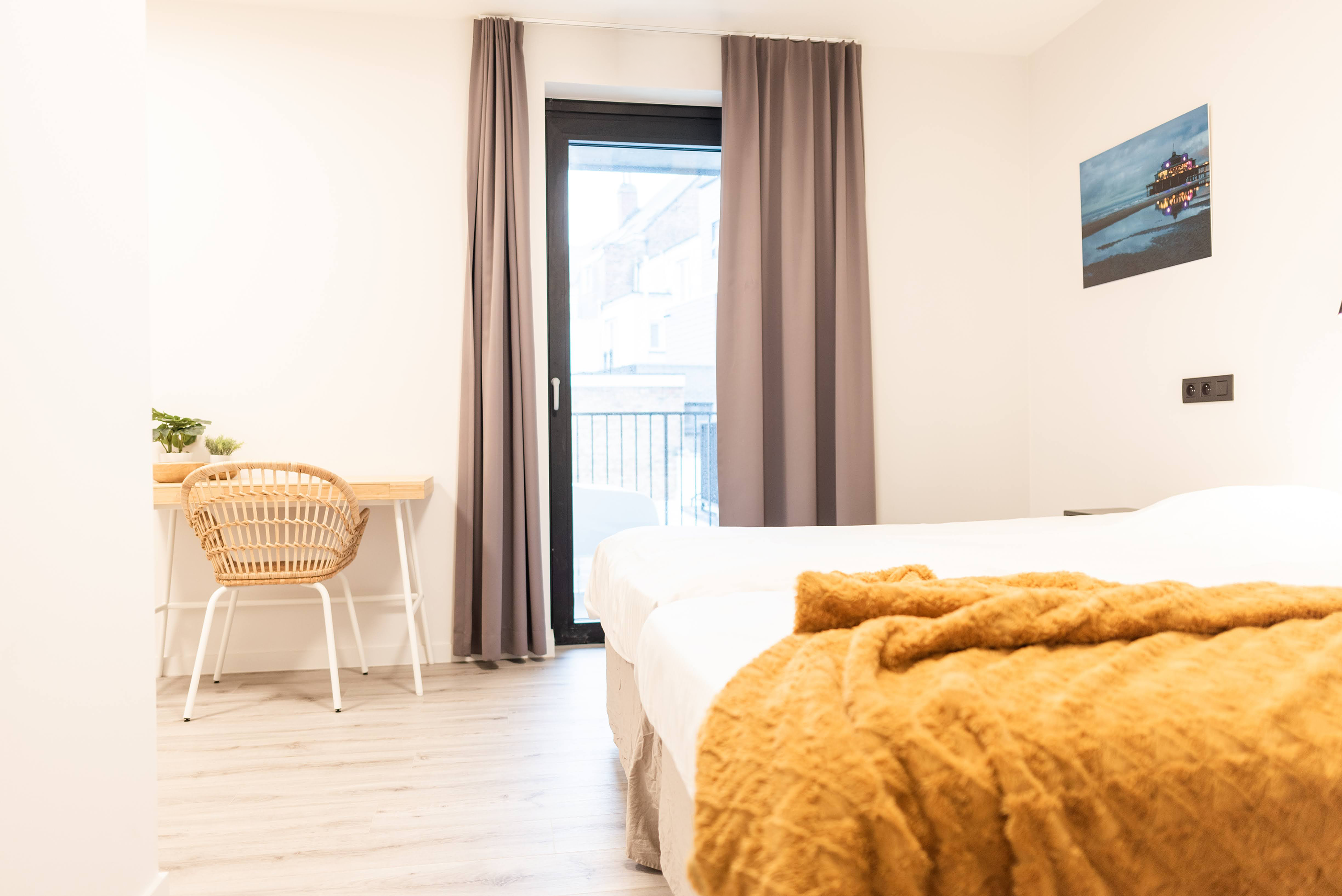 Tweepersoonskamer met twee enkele bedden