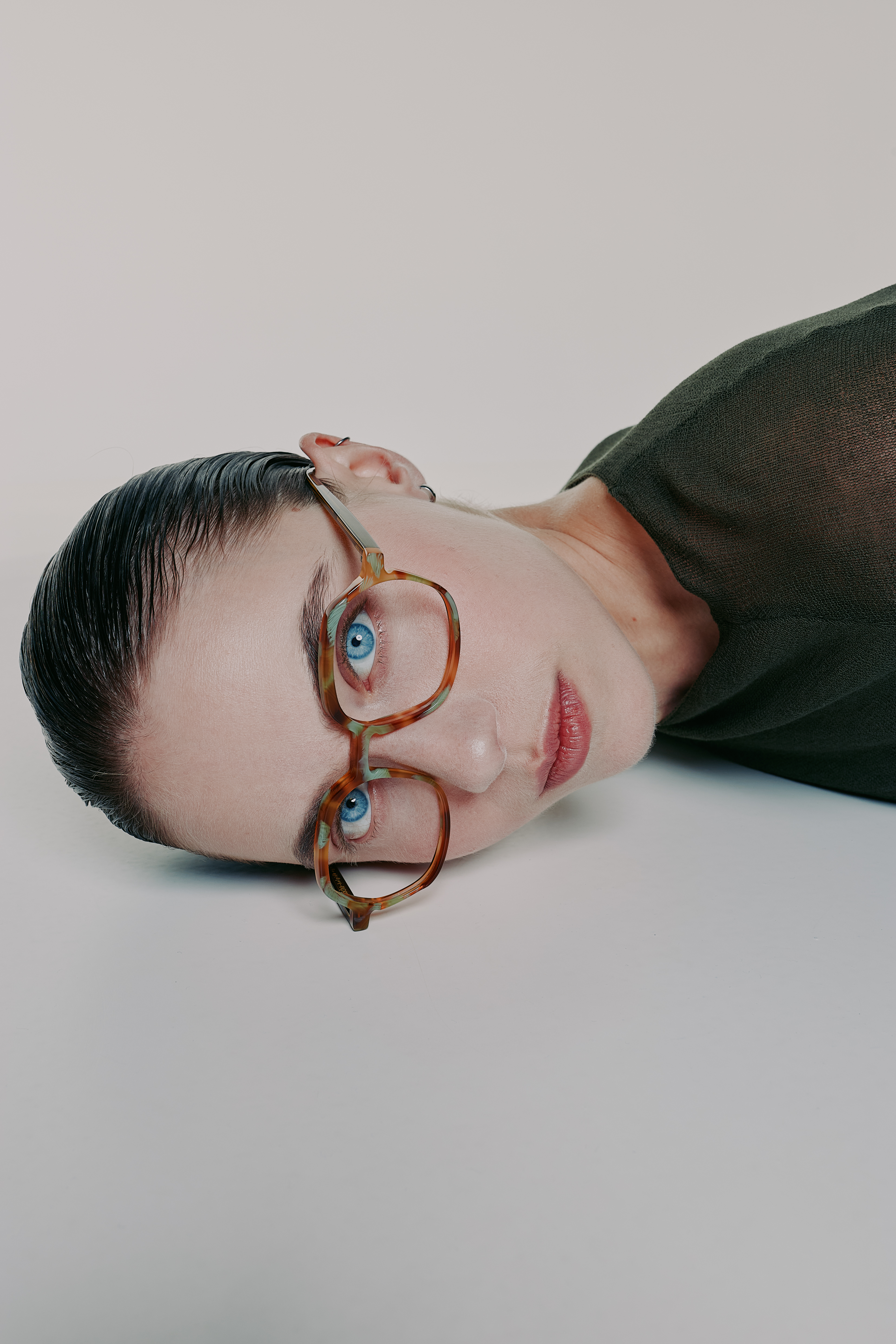 woman wearing coloured acetate glasses