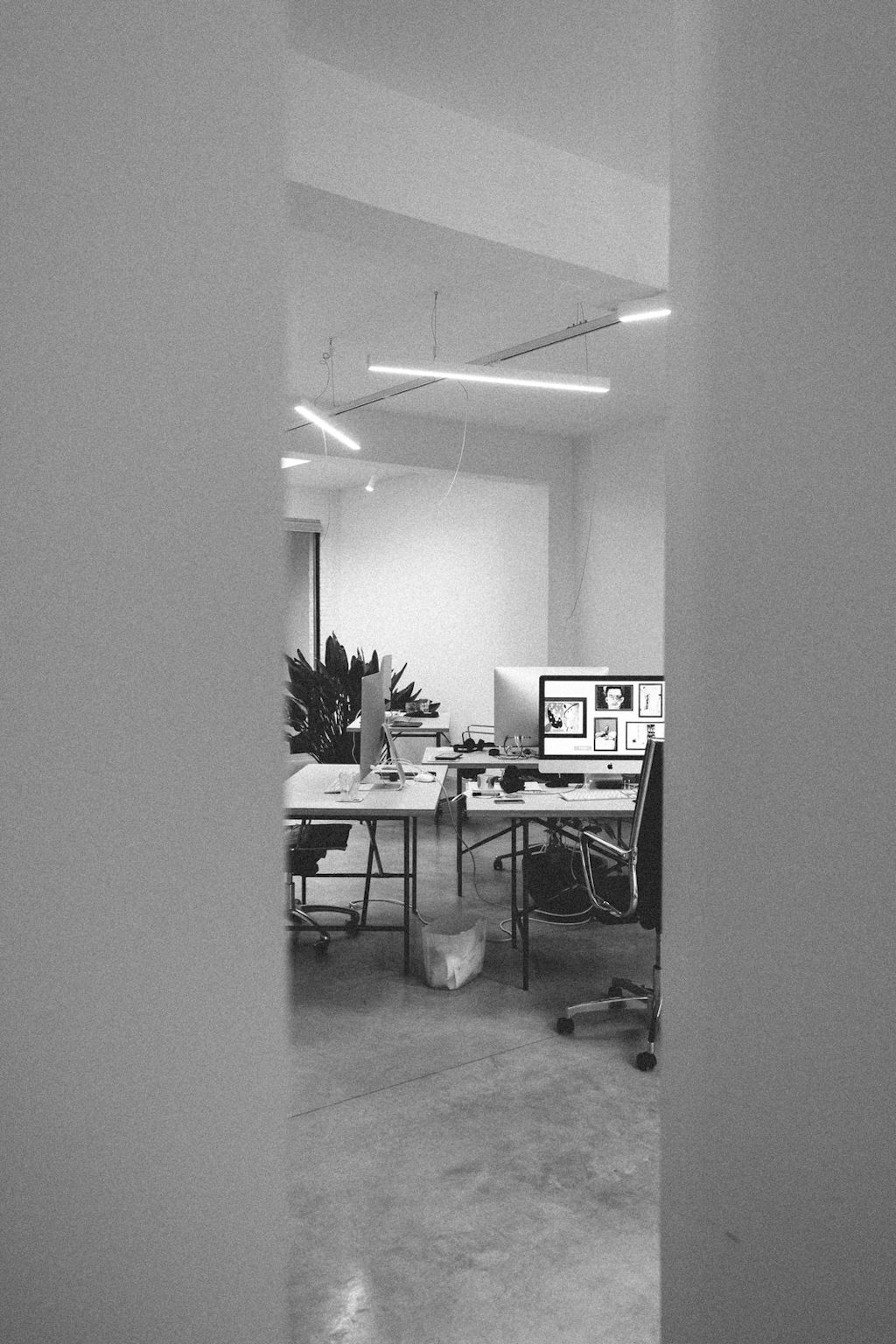 A view of our office, showing a few desks with computers on them.